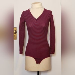 Red, blue and white stripped vintage bodysuit. Has room to stretch.